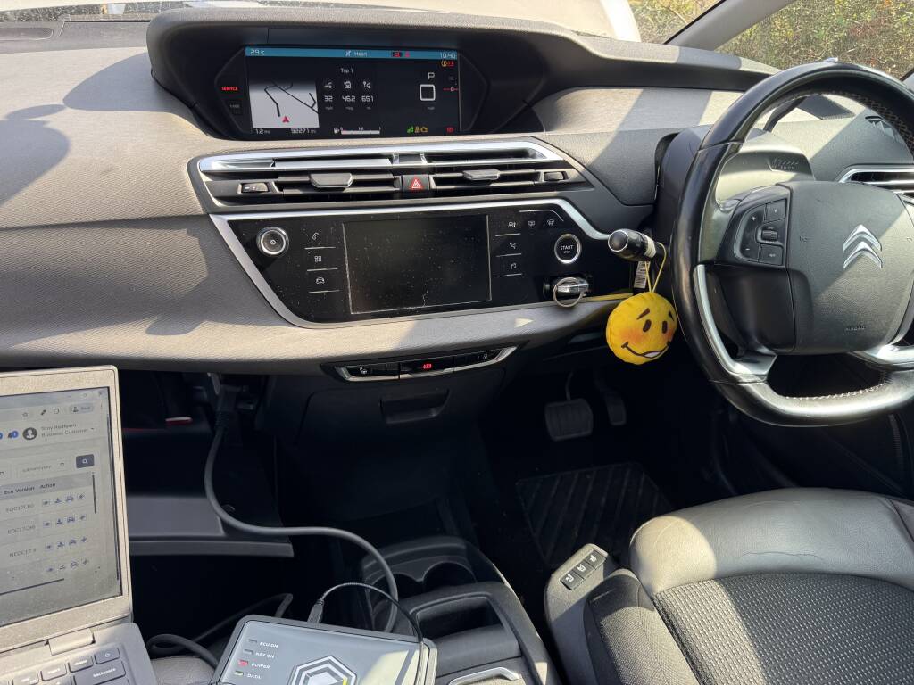 Engine management warning light on Citroen C4 dashboard before repair in Helston