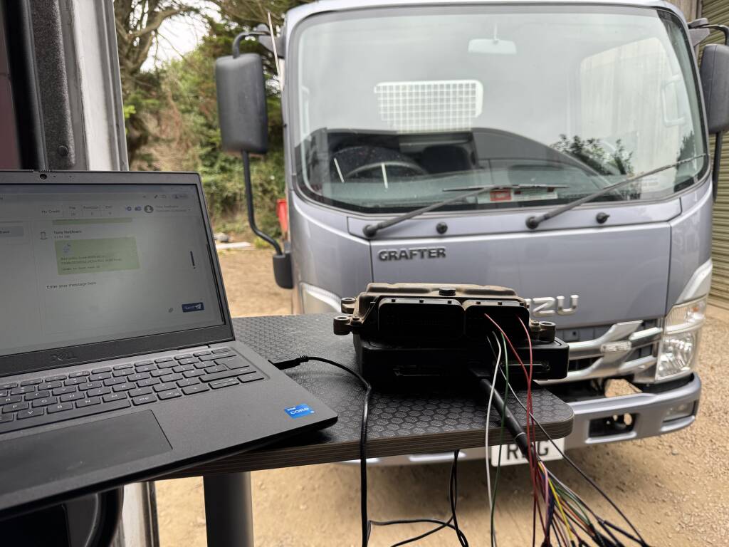 Kernowsport mechanic removing ECU from 2022 Isuzu Grafter cab-over truck in Helston Cornwall