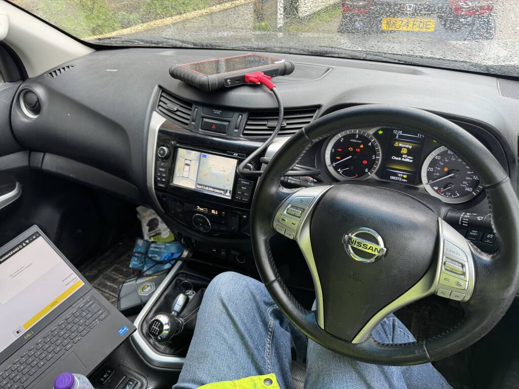 Close-up of Nissan Navara Engine Dash During Adblue System Inspection. - Kernowsport Performance Tuning Close-up of Nissan Navara engine dash during AdBlue system inspection.
