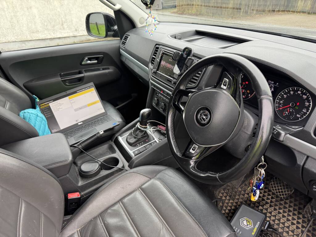Laptop and tuning tools in use while clearing AdBlue countdown on Amarok.