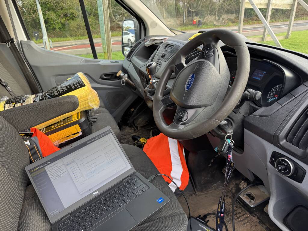 Laptop displaying ECU data during Ford Transit remap and speed limiter removal.