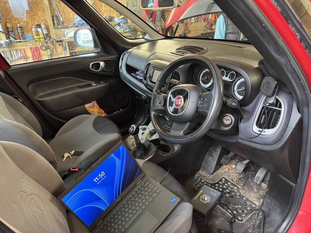 Kernowsport technician connecting diagnostic tools to Fiat 500 ECU.